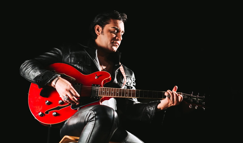 Aaron White as Elvis Presley